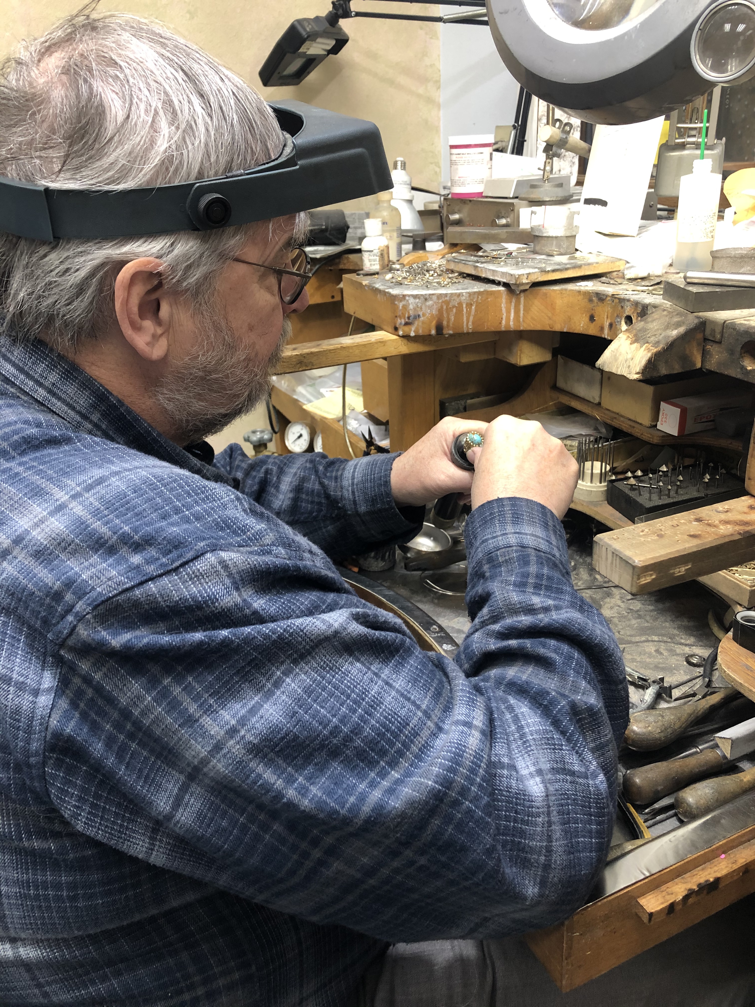 Tom Gould working at his goldsmithing bench